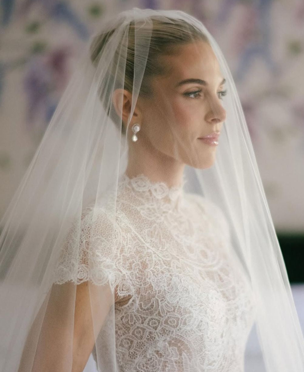Bride wearing a blusher veil over her face