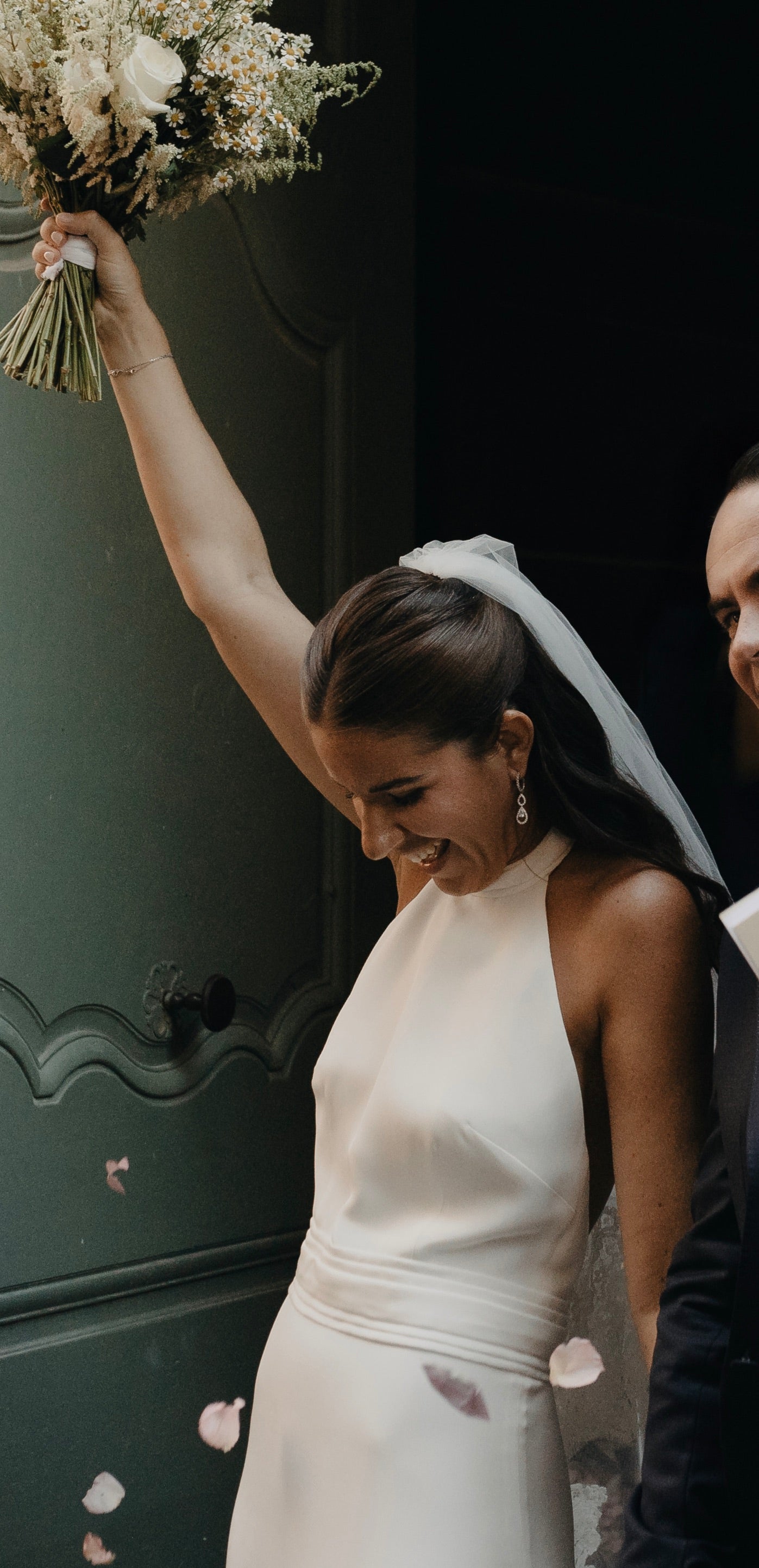 Catholic wedding ceremony with the bride wearing a lace bridal veil