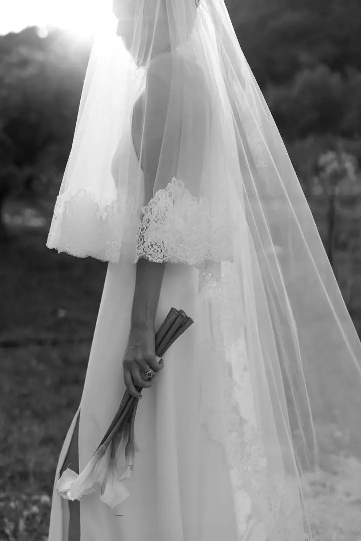 Lace details from a cathedral wedding veil with flower details