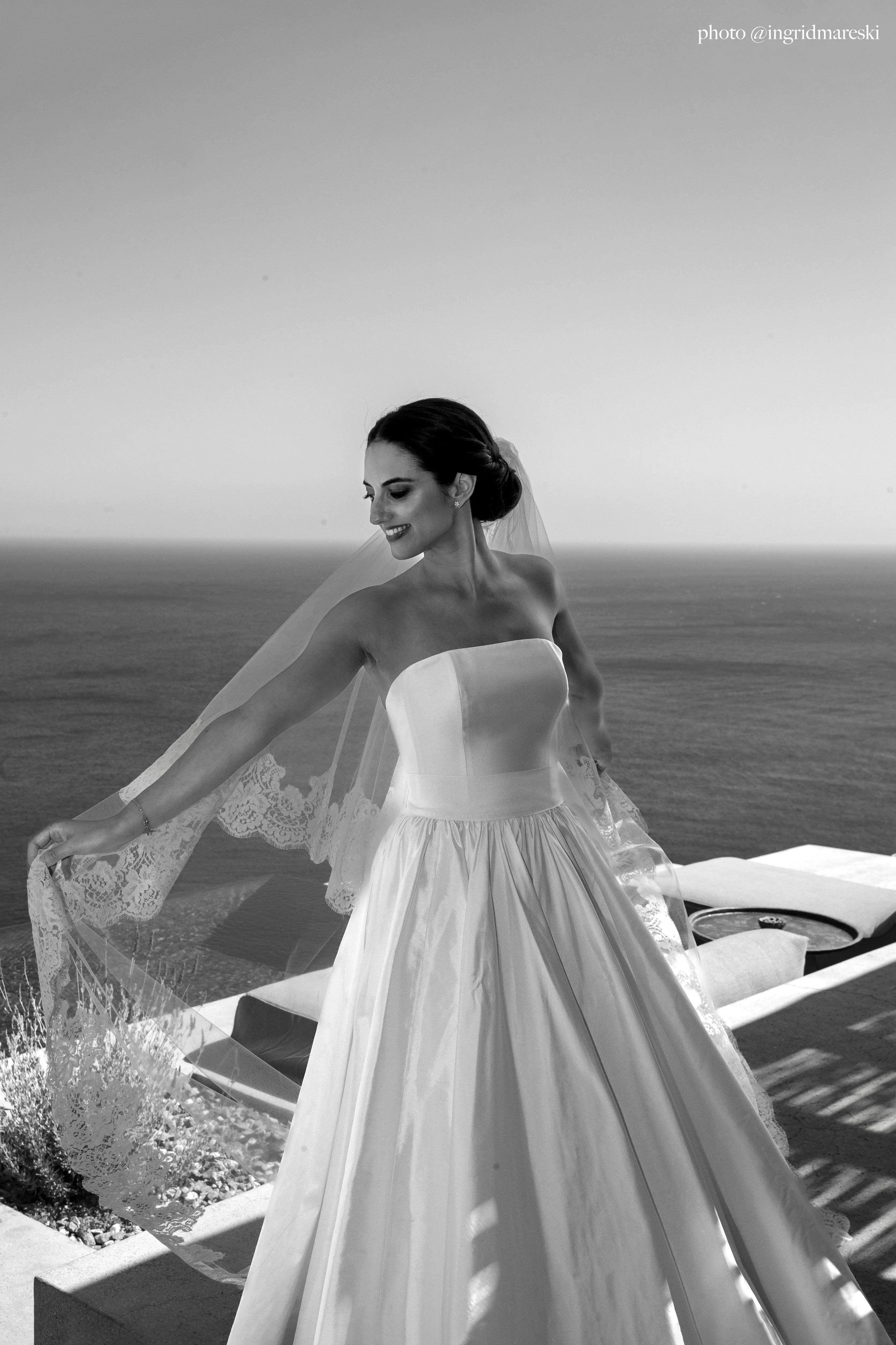 Layered tulle and lace wedding veil adding ethereal volume to a traditional bridal look.