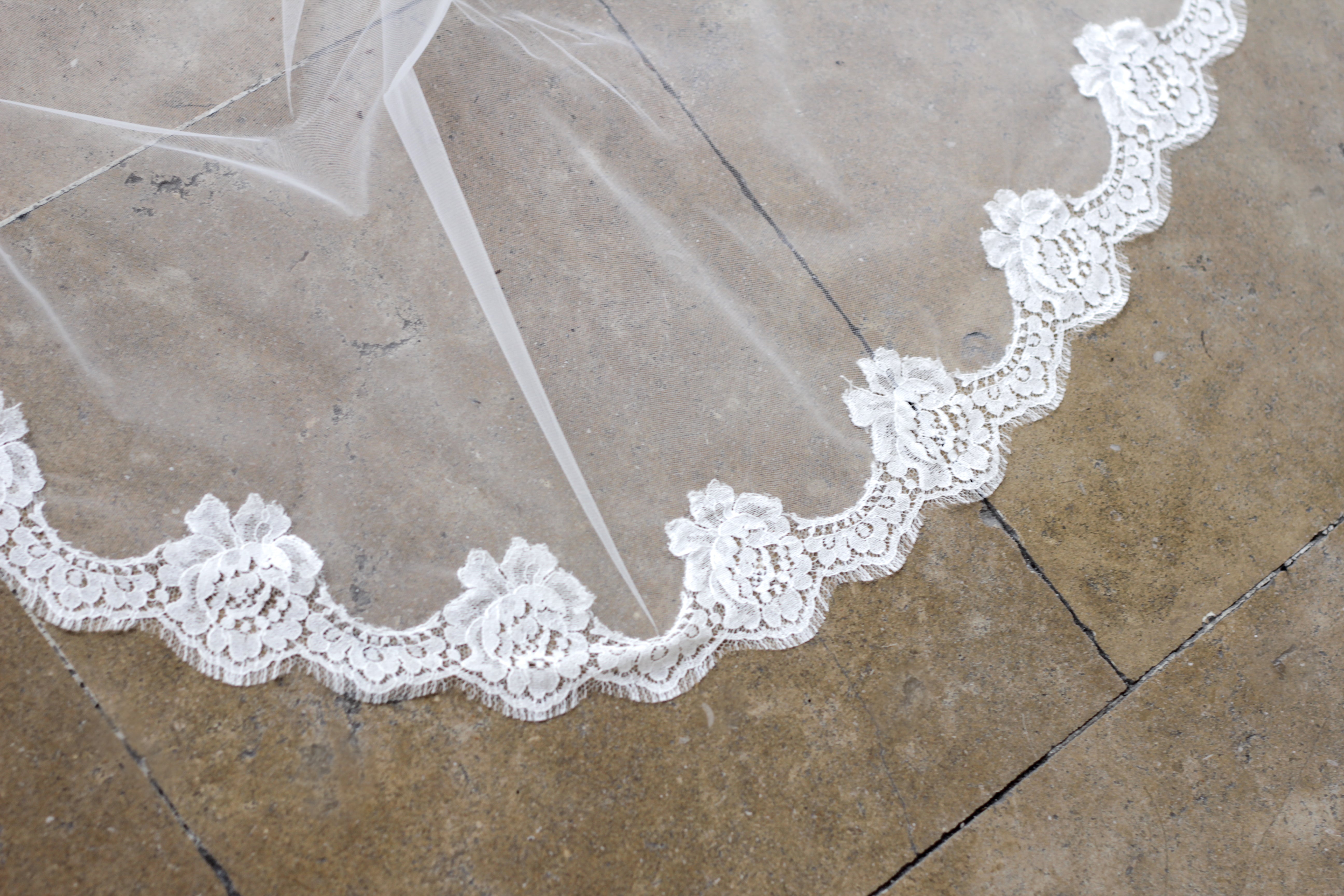 Handcrafted lace wedding veil with scalloped edge detail