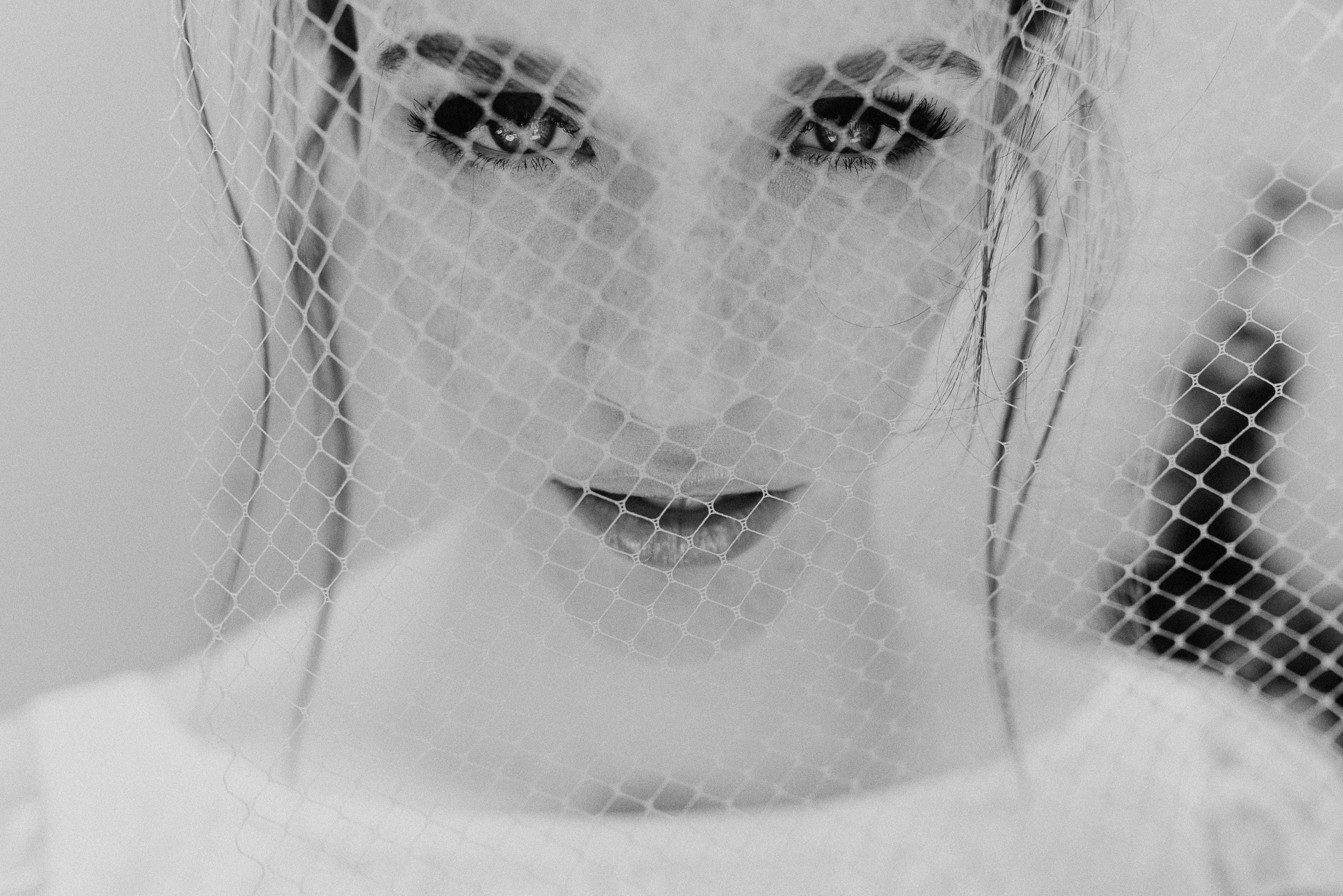 Minimalist wedding veil with French netting and elegant curved shape
