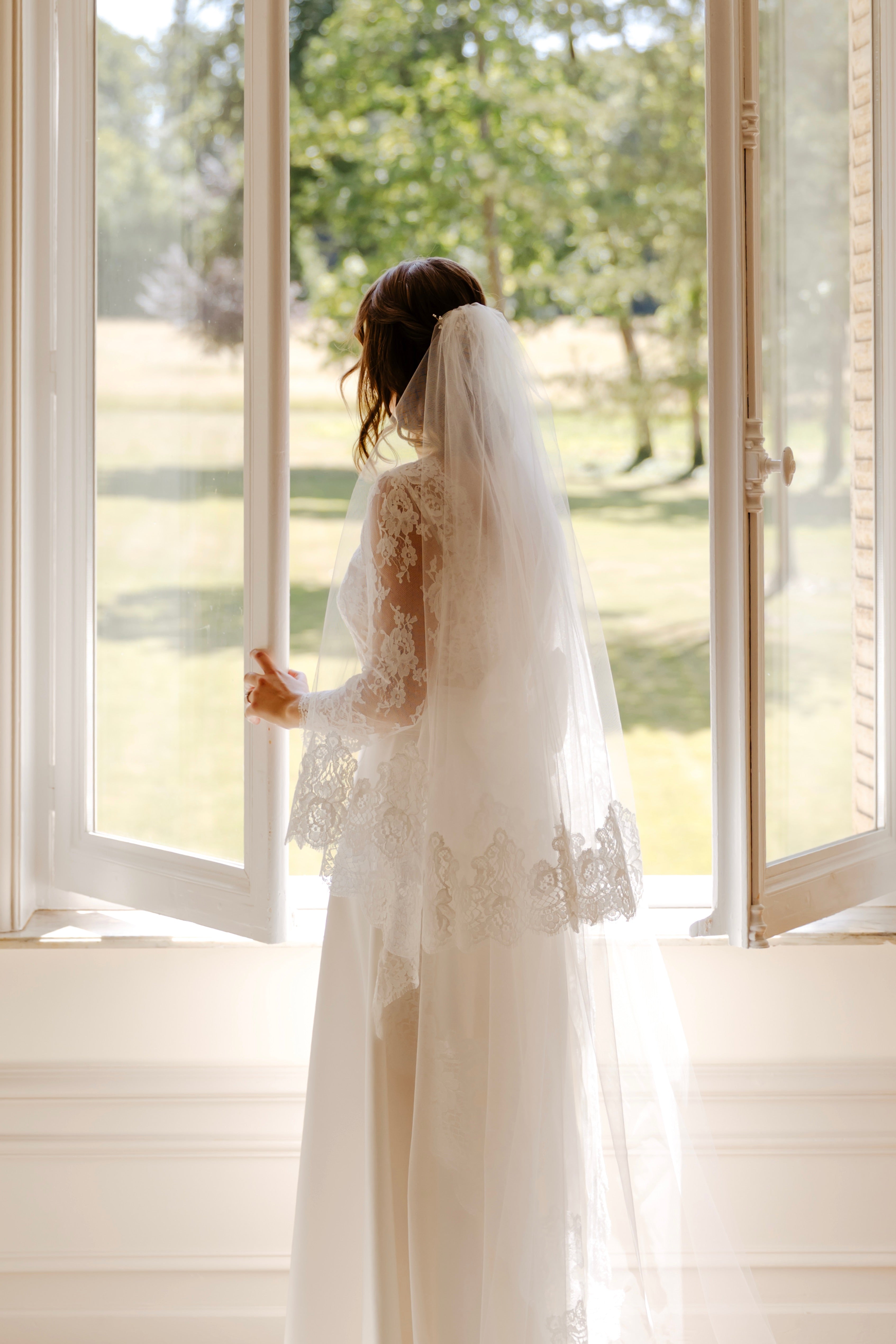 Cathedral-length mantilla wedding veil with a circular shape and Calais lace edge, hand-finished in France
