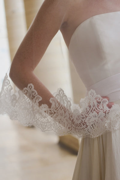 Tulle and lace wedding veil blusher blowing in the wind