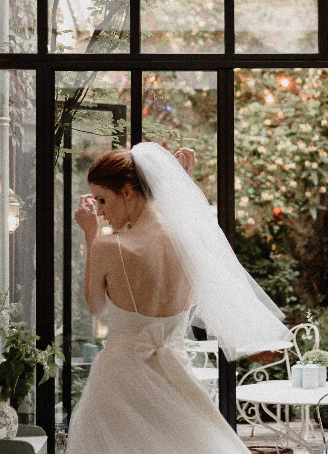 Side view of lightweight bridal veil Pour Toujours in natural white silk tone