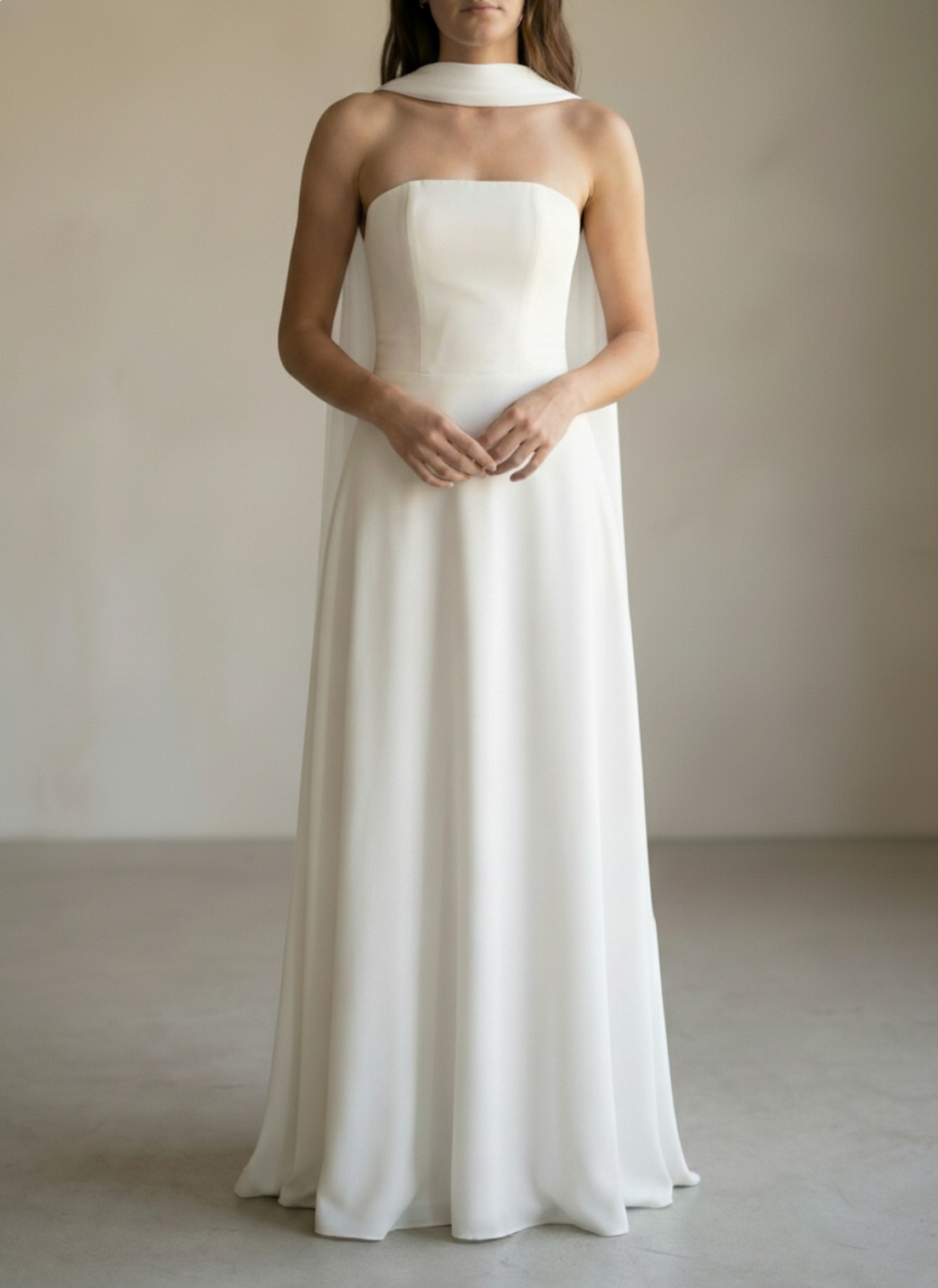 Bias-cut silk bridal scarf in light ivory draped over a wedding dress